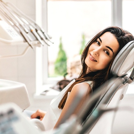 A female patient waiting in the dentist’s chair for her appointment to begin