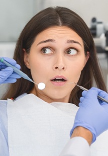 nervous woman in dental Chair