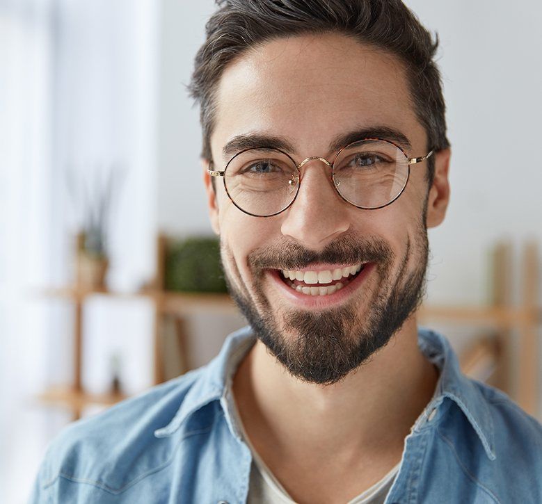 man with glasses and beard smiling