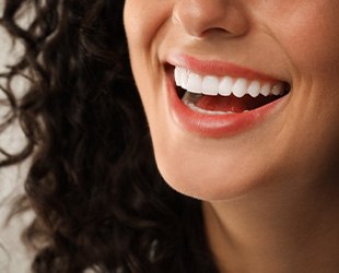 Close-up of woman’s smile with beautiful white teeth