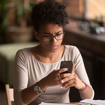 girl looking at phone