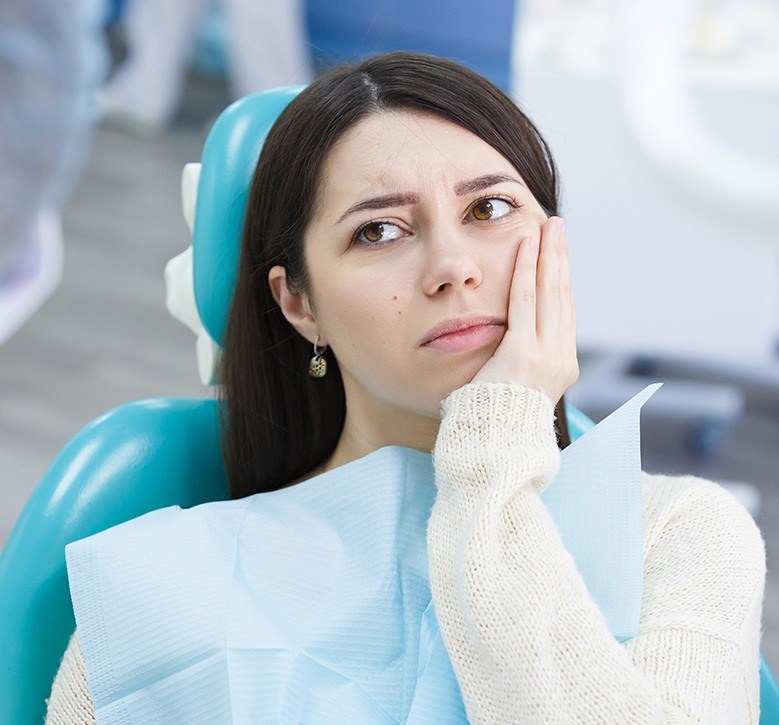 Young woman with tooth pain