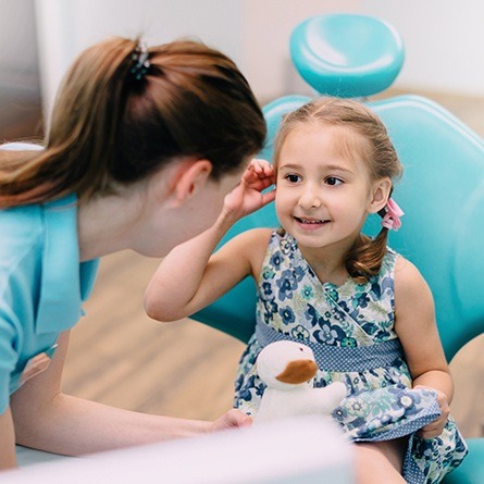 little girl sitting in chair