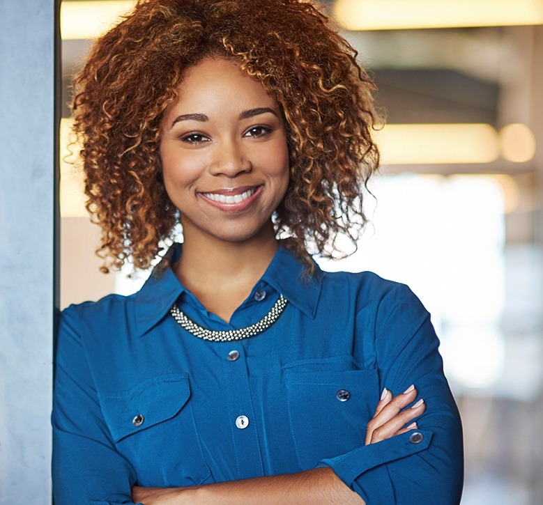 woman with curly hair smiling