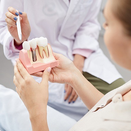 dentist pointing to implant