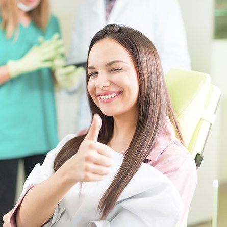 woman doing thumbs up