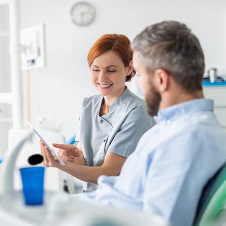 female team member talking to patient