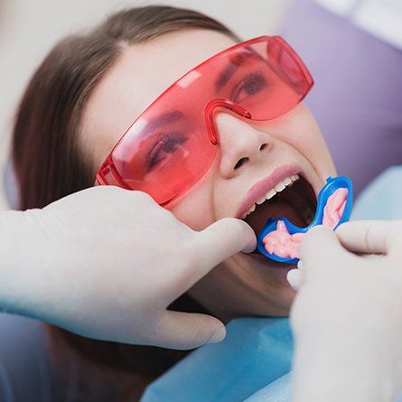 young woman getting fluoride treatment