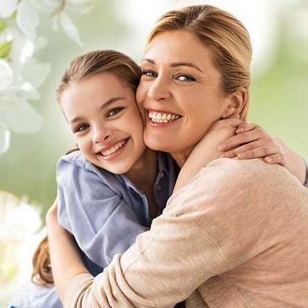 beautiful mother and daughter smiling