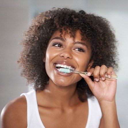 woman brushing teeth