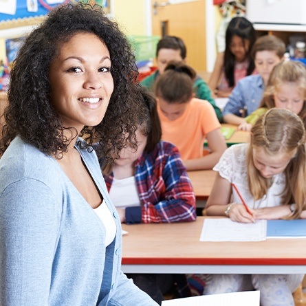 Teacher smiling in classroom