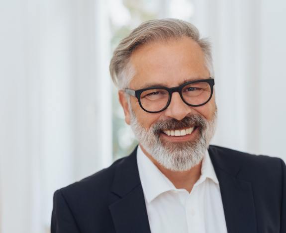 man in suit and glasses