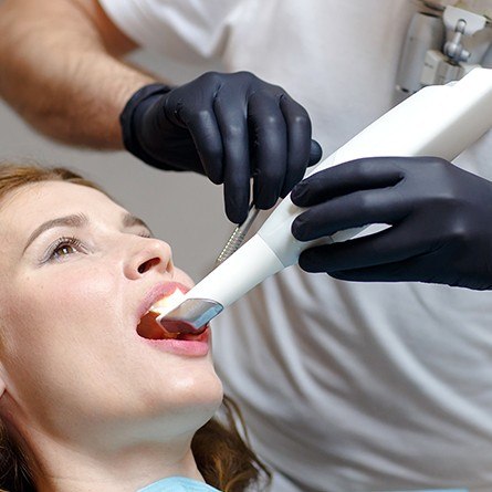 Dentist using intraoral camera