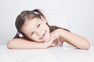 young smiling girl, girl with missing teeth, children's dentist