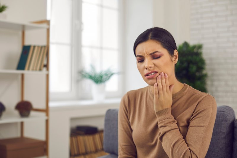 woman with jaw pain on one side