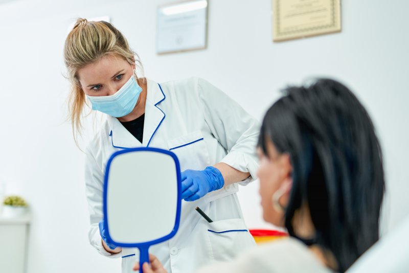 a patient talking with a cosmetic dentist 